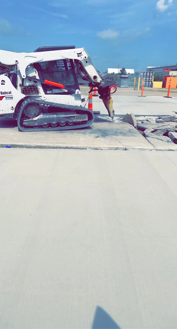 K&K Contracting - asphalt project in progress - breaking up old concrete to clear away - St. Louis, MO